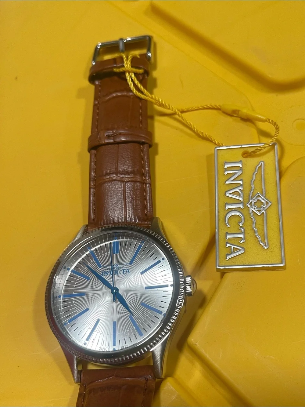 Invicta Silver Dial Watch with Blue Accents and Brown Leather Strap